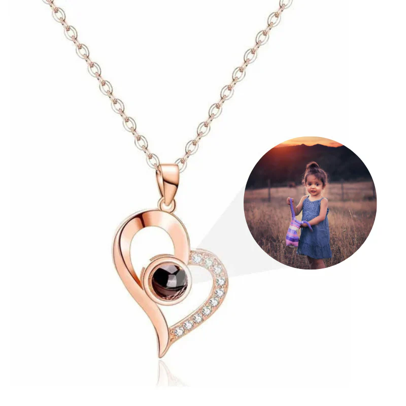 Heart-shaped necklace with a photo of a child on a white background