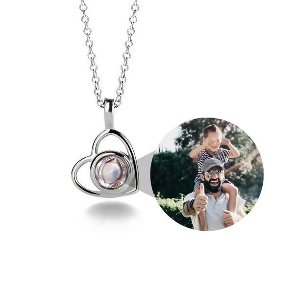 Heart-shaped photo locket necklace with a circular photo insert on a white background